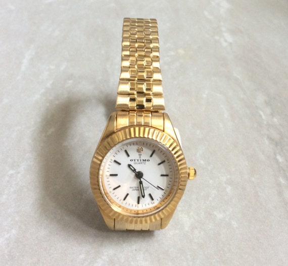 OTTIMO Women's Watch Round White Dial Black Index Hours on Gold Stretch  Band Waterproof 3ATM New Unused Vintage Item!