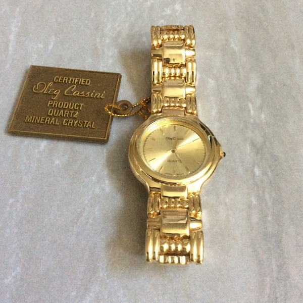 Oleg Cassini Men's Dress Watch Round Gold Dial Index Hours on a Beautiful Gold Linked Band Vintage Unused New Item!