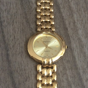 Vintage Rare Men's Oleg Cassini Gold Watch Round Gold Dial on Gold Linked Band In Vintage Mint Condition!