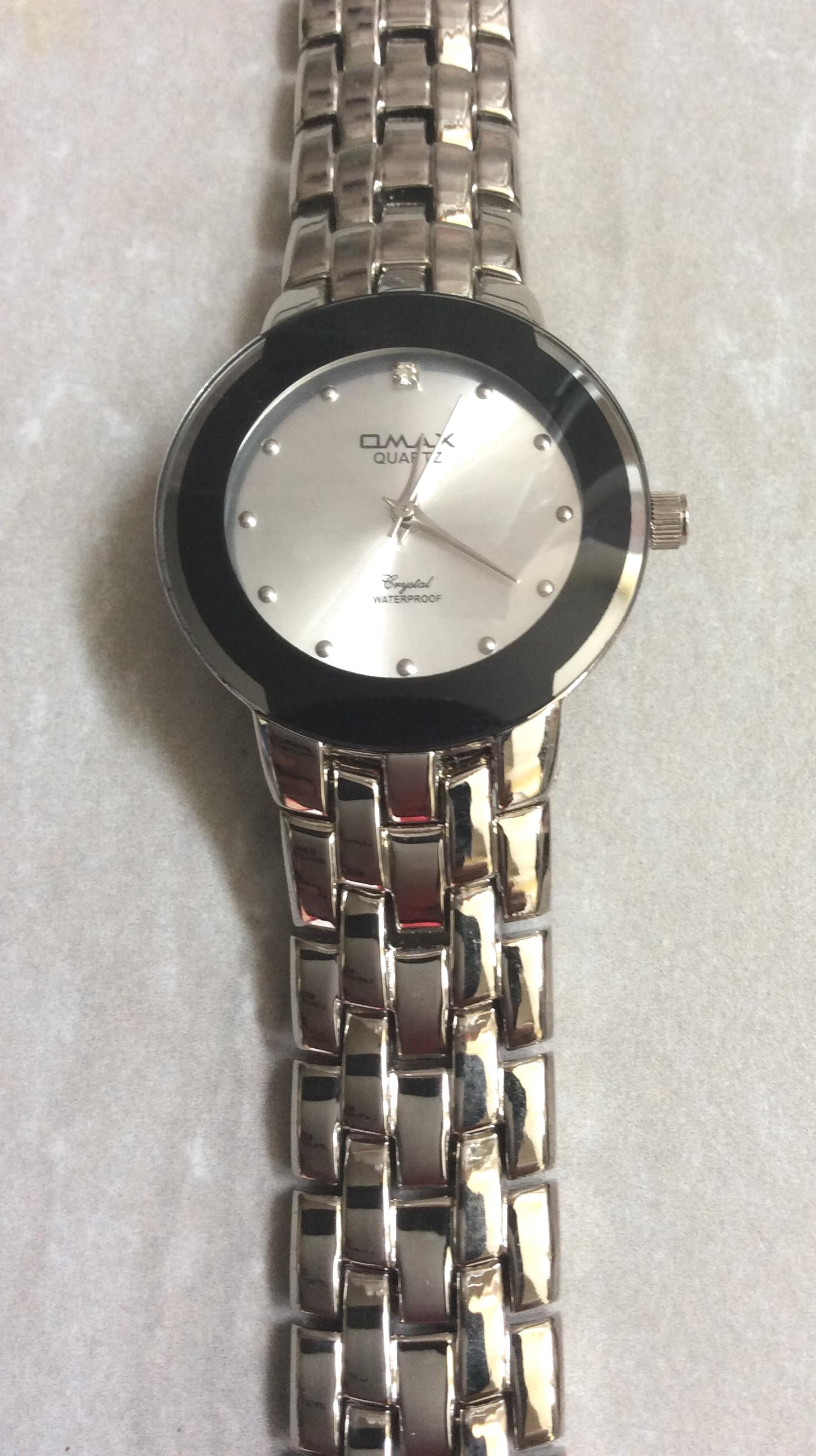 OMAX Women's Silver Watch: Round Dial, Black Border, Silver