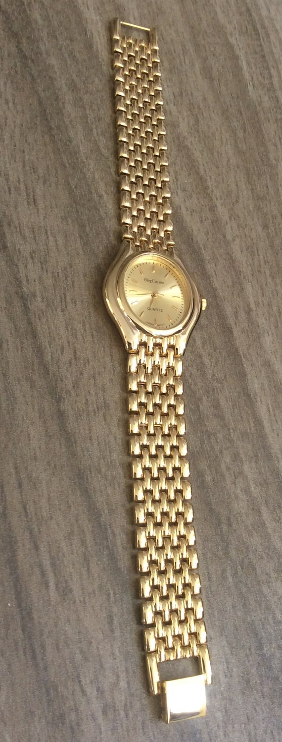 Oleg Cassini Men s Gold Watch Oval Dial With Index Hour Marker s on a Unique Gold Linked Band Vintage Watch in New Mint Condition Rare Etsy