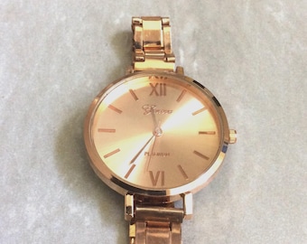 Geneva Rose Gold Watch: Round Dial, Roman Numeral Markers, Linked Band