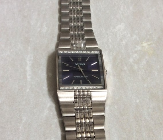 ORIENT Men's Silver Watch Square Blue Dial Crystal Bezel on Silver