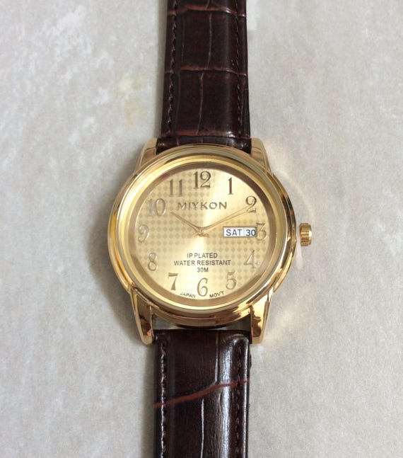 MIYKON Men s Gold Watch Round Gold Accented Dial Numbered Hours on Cherry Black Leather Band New Unused Vintage Item Water Resistant 30M Etsy