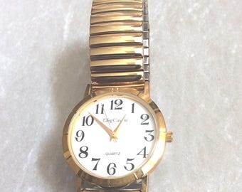 Oleg Cassini Gold Women&#39;s Watch Round White Dial with Easy to Read Black Arabic Numbered Hours Gold Stretch Band Vintage Mint Condition Rare