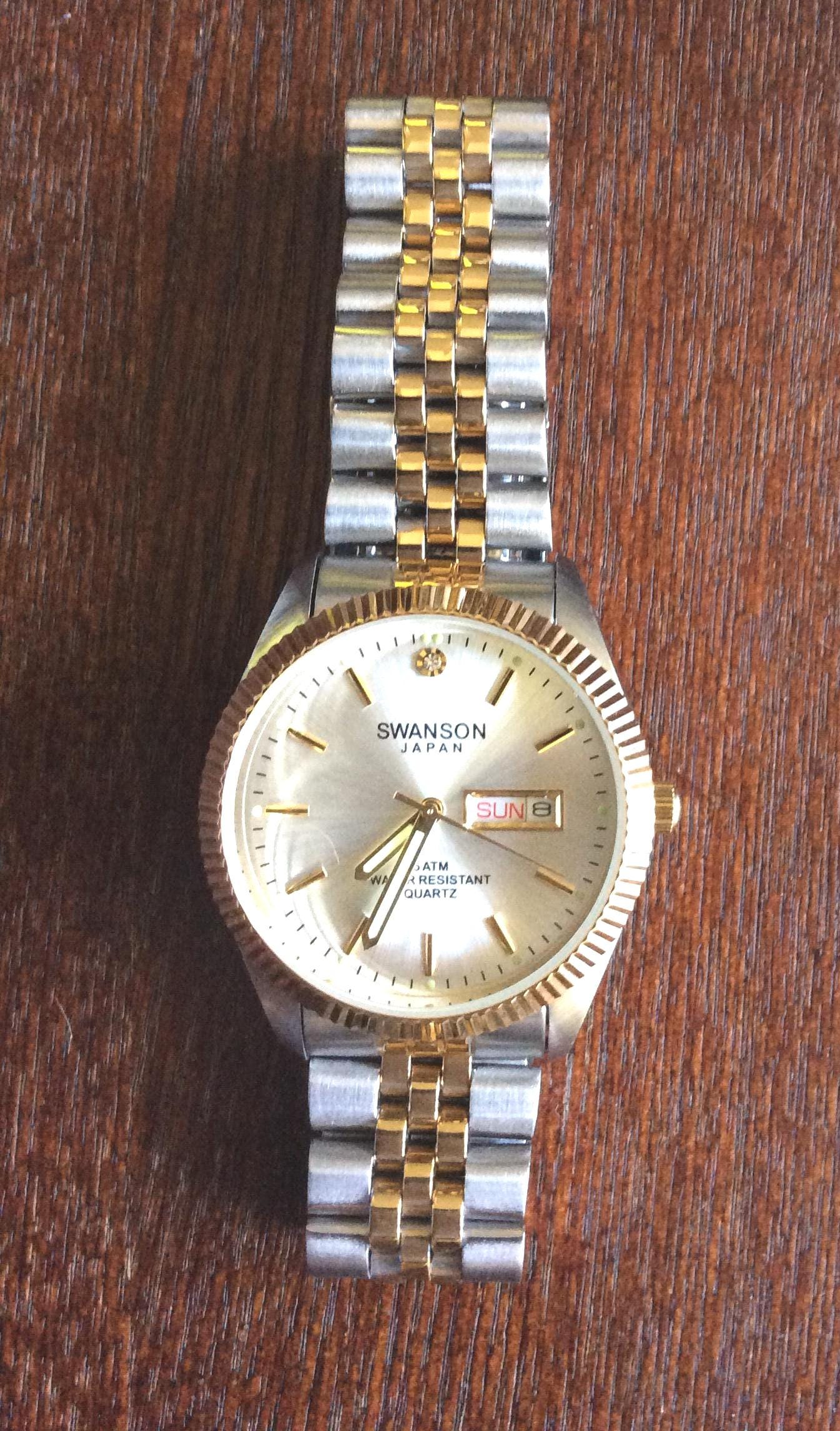SWANSON Men's Watch Round Silver Dial Gold Index Hour Markers on