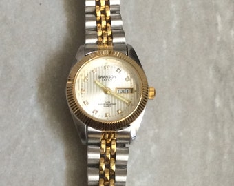 SWANSON Women's Watch Round Silver Dial Crystal Hours Day & Date Indicator on Two-Tone Linked Bracelet Vintage New Unused Item Works Perfect