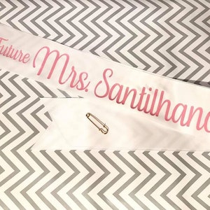 Personalized Sash for Bridal Showers, Bachelorette Parties, Baby Showers, Birthdays, Job Promotions and Pageants. Custom Sayings Available.