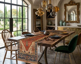 May include: A dining room scene featuring a large wooden table with a patterned runner. The table is set with plates, cutlery, and a teapot. Overhead, several pendant lights hang. The room includes a large window, chairs, and a decorative mirror.