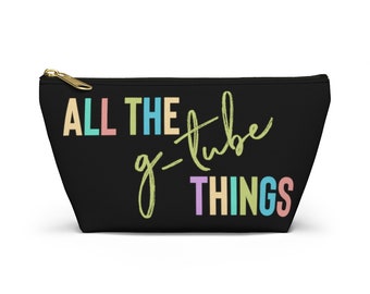 May include: Black zippered pouch with the text "ALL THE g-tube THINGS" in colorful letters.