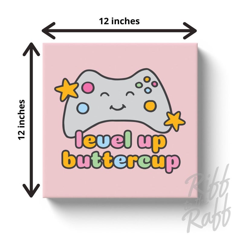 May include: A 12-inch square canvas print with a pink background. It features a smiling gray video game controller with colorful buttons and star accents. The text "level up buttercup" is below the controller.