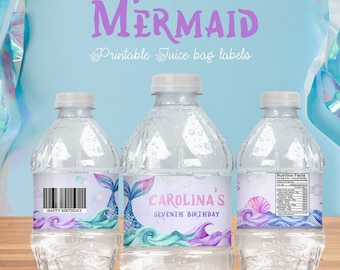May include: Three clear plastic water bottles with colorful mermaid-themed labels. The labels feature a mermaid tail, seashells, and bubbles. The middle label reads "Carolina's Seventh Birthday".