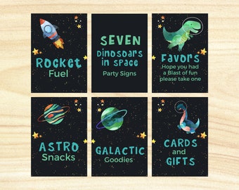 May include: Six printable party signs with a space and dinosaur theme. The signs feature a rocket, planets, dinosaurs, and stars on a black background. The text on the signs reads: Rocket Fuel, Seven Dinosoars in Space Party Signs, Favors Hope you had a Blast of fun please take one, Astro Snacks, Galactic Goodies, Cards and Gifts.