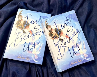 Signed copies of Just Between Us by Adeline Kon