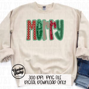 May include: A beige sweatshirt with a green, red, and white "Merry" design. The design is made of different patterned fabrics and has a glittery effect.