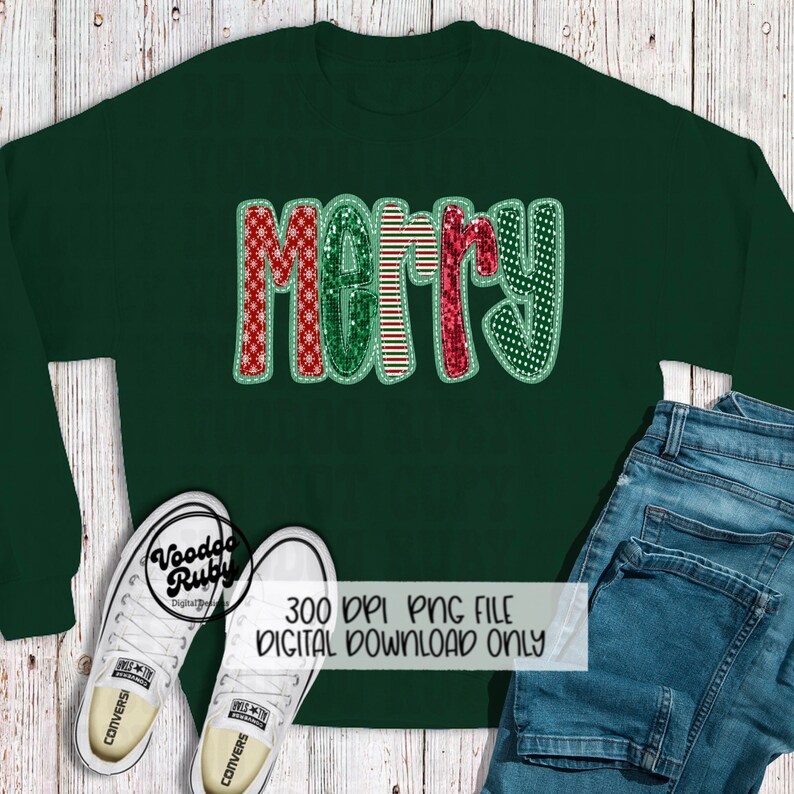 May include: A green sweatshirt with a red, green, and white "Merry" design. The design is made of different patterned fabrics and has a glittery finish.