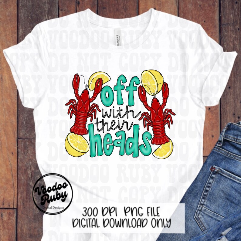 May include: A white t-shirt with a graphic design of two red crawfish holding lemon slices and the text "off with their heads" in teal.