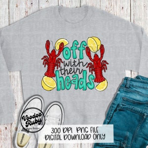 May include: A gray sweatshirt with the text "Off with their heads" in teal lettering. Two red crawfish are on either side of the text, each with a lemon wedge on top.
