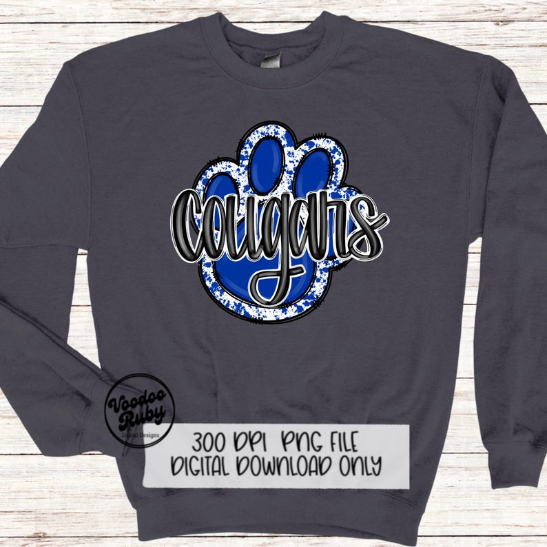 May include: A dark blue sweatshirt with a blue and white paw print graphic and the word "cougars" in black text.