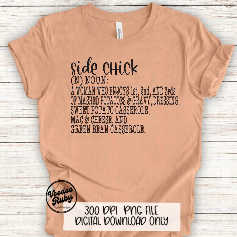 May include: A tan t-shirt with black text that reads "side chick (N) NOUN: A woman who enjoys 1st, 2nd, and 3rds of mashed potatoes & gravy, dressing, sweet potato casserole, mac & cheese, and green bean casserole."
