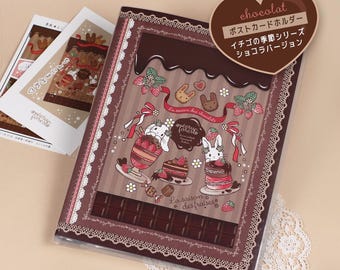 Puede incluir: Un álbum de fotos marrón y blanco con un tema de chocolate y fresas. El álbum presenta una barra de chocolate, fresas y conejos. El texto en el álbum dice "chocolat", "Porta tarjetas postales", "Serie de la temporada de fresas", "Versión chocolate", "La saison des chocolats" y "La saison des fraises".