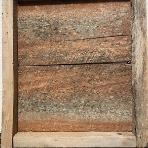 May include: A rustic wooden frame with a weathered, gray and brown wood surface. The frame is made of reclaimed wood and has a natural, distressed look.