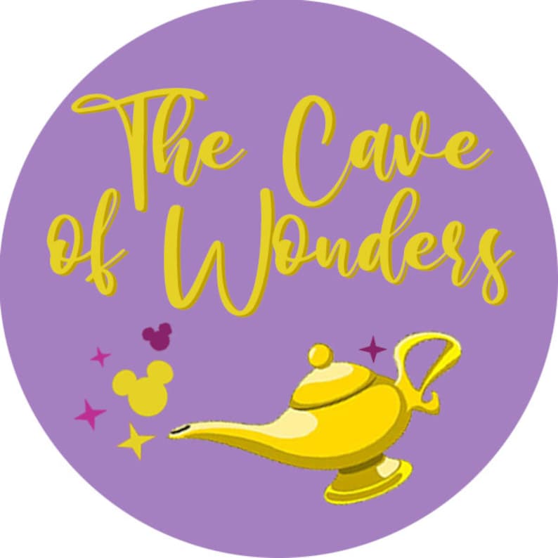 May include: Purple circle with the text "The Cave of Wonders" in yellow script. A gold genie lamp with a purple star above it is in the bottom right corner. Two yellow Mickey Mouse heads are in the top left corner.