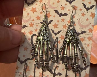 Boney skeleton hand earrings