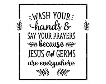 May include: Black and white square sign with the text "WASH YOUR hands & SAY YOUR PRAYERS because JESUS and GERMS are everywhere." The sign has a black border and leaf accents.