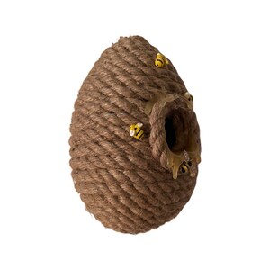 May include: A brown rope beehive with a hole in the front and yellow bees attached to the outside.