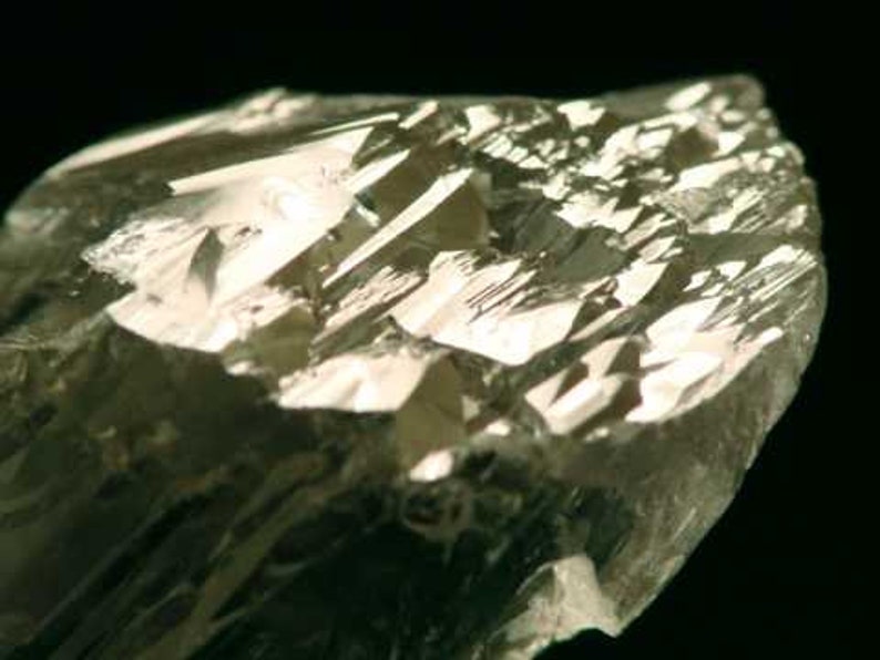 Close up view of Natural Gemmy Yellow Kunzite Crystal, photo was taken inside under fluorescent lights.