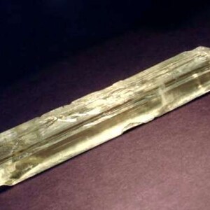 Side view of Natural Gemmy Yellow Kunzite Crystal, photo was taken inside under fluorescent lights.