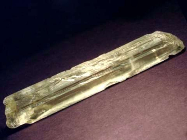 Side view of Natural Gemmy Yellow Kunzite Crystal, photo was taken inside under fluorescent lights.