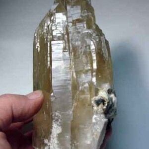 Side view of Natural Color Citrine Rough - photo was taken inside under fluorescent lights.