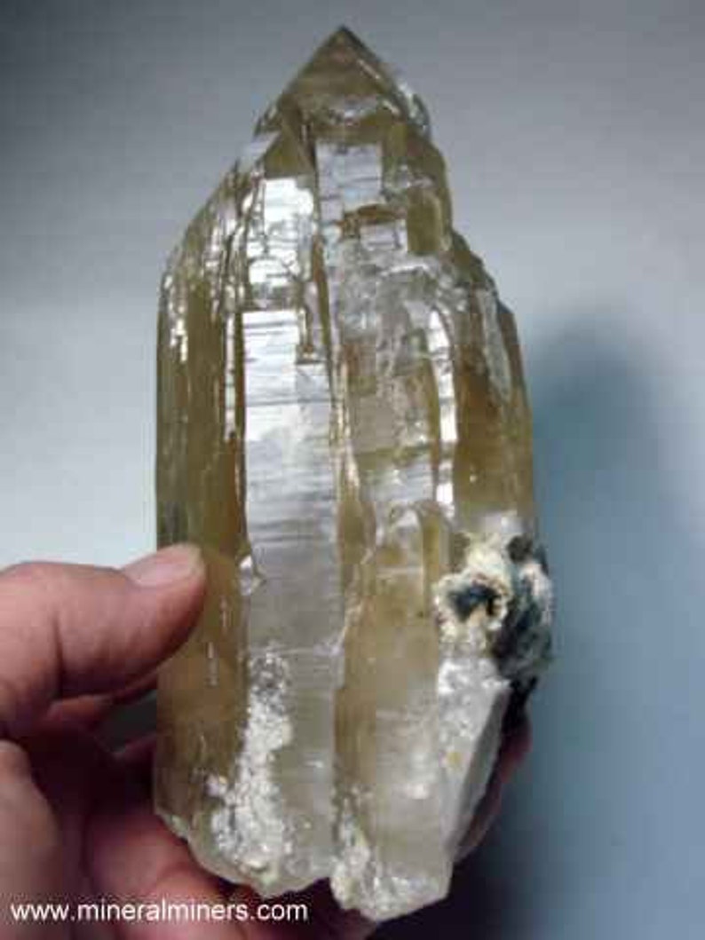 Side view of Natural Color Citrine Rough - photo was taken inside under fluorescent lights.