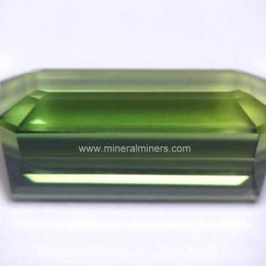 Side view of Flawless Large Green Tourmaline Gemstone - photo was taken inside under fluorescent lights.