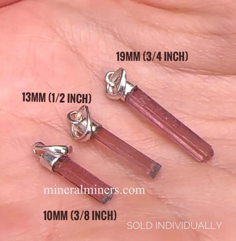 May include: Three pink tourmaline crystal pendants with silver bails. The pendants are 10mm (3/8 inch), 13mm (1/2 inch), and 19mm (3/4 inch) in length. The text "mineralminers.com" and "SOLD INDIVIDUALLY" is visible in the image.