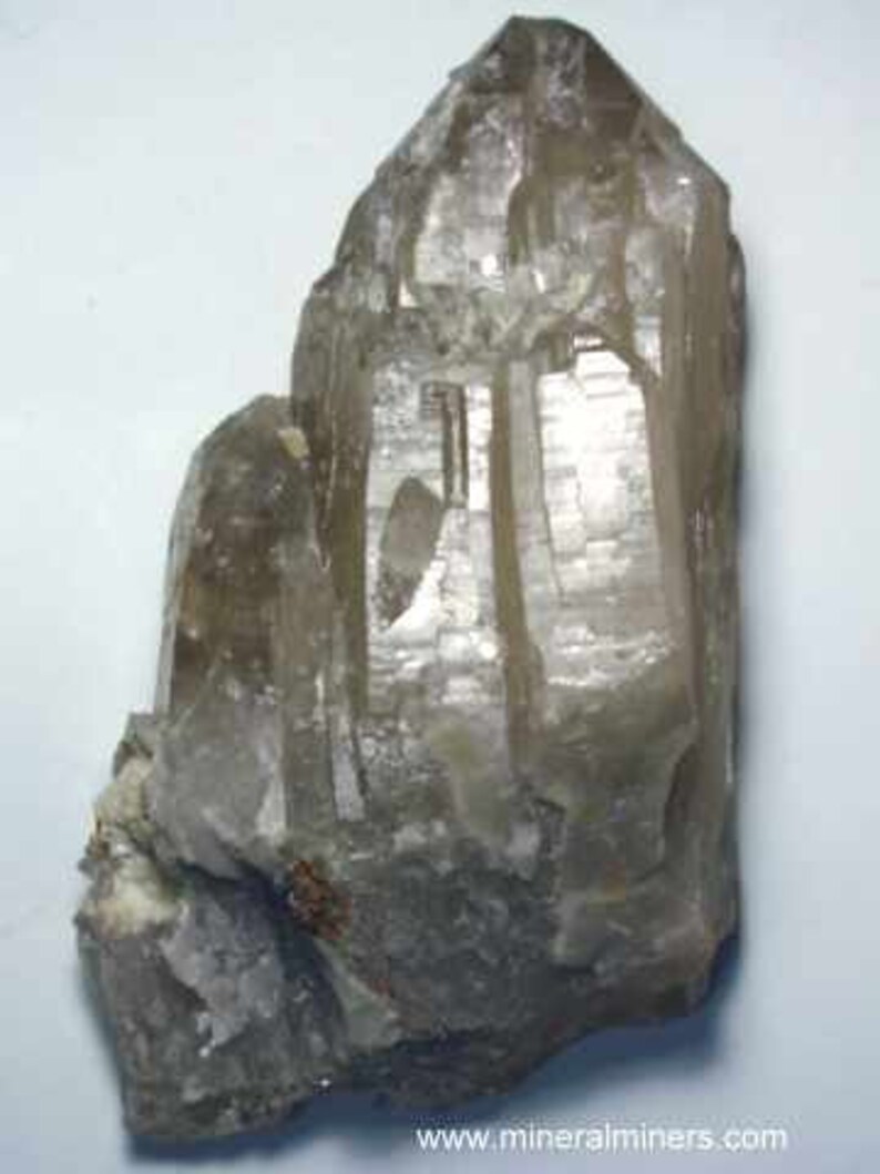 Back view of Natural Color Citrine Rough - photo was taken inside under fluorescent lights.