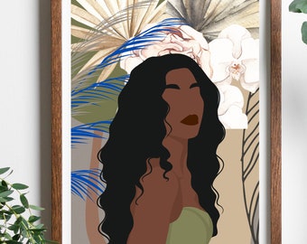 May include: A framed art print depicting a stylized illustration of a woman with dark skin and long, wavy black hair. The background features floral and botanical elements in white, blue, and beige. The woman is wearing a green top.