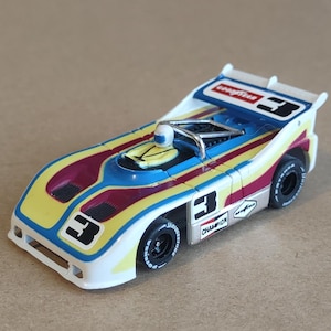 Slot Car, HO (1/64) scale  AFX Porsche 510K Goodyear number 3 Can Am New Old Stock body on New AFX Mega G plus chassis