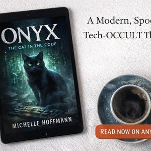 May include: A tablet displays the book cover for "ONYX: The Cat in the Code" by Michelle Hoffmann. The cover features a black cat with green eyes. Text reads "A Modern, Spooky Tech-OCCULT Thriller." A cup of coffee sits on a saucer next to the tablet.