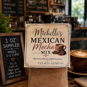May include: A clear plastic pouch containing brown powder, labeled Michelle's MEXICAN Mocha MIX. The label features a brown mug graphic, the website MichellesMexicanMocha.com, and the text 715-821-5170 1oz. The pouch is square with decorative borders.