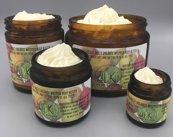 May include: Four amber glass jars of varying sizes, each filled with a swirl of creamy, off-white whipped body butter. The jars have labels with text and illustrations. The product is labeled as "Citrus Breeze Organic Whipped Body Butter."