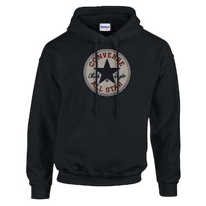 May include: Black hooded sweatshirt with a vintage Converse All Star logo featuring a white star and red text.