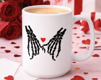 Skeleton Hand Holding Heart Ceramic Mug