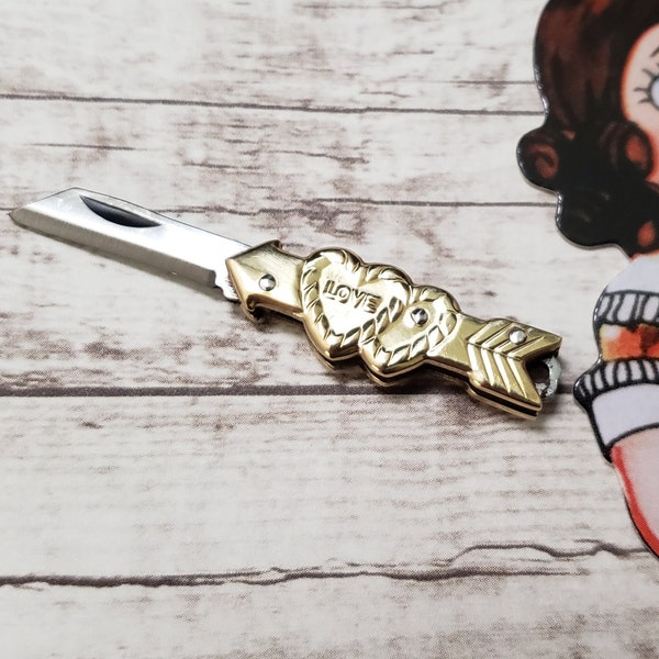 Miniature Love Heart Knife Charm - Tiny Retro Folding Knife with Hearts and Arrow - Shiny Brass Sweetheart Cupid Mini Novelty Knife Charm