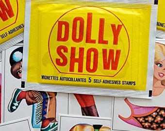 May include: A collection of vintage "Dolly Show" self-adhesive stamps. The yellow packets feature the text "DOLLY SHOW" in red, with additional text. Surrounding the packets are various doll illustrations, including portraits and fashion sketches.