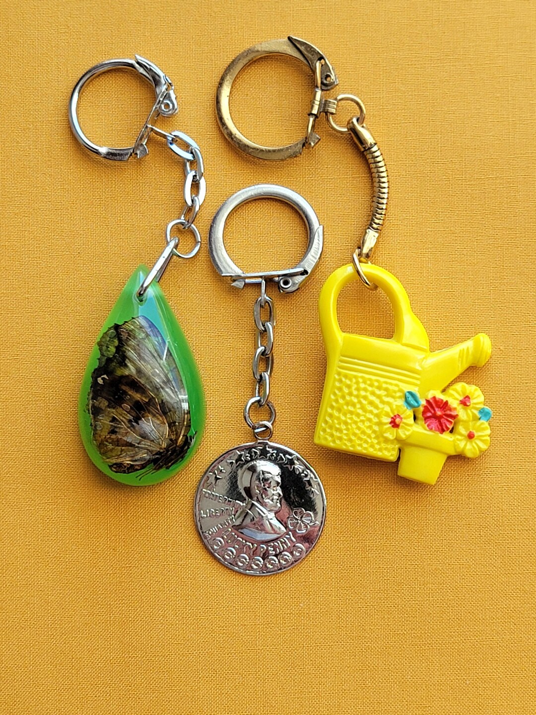 3 Vintage Keychains Butterfly in Resin Lucky Penny Watering Can
