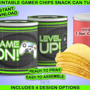 May include: Printable snack can tube templates for crisps. The design features a black and green gamer theme with the text "Game On!" and "Level Up!" and a video game controller graphic. The can tube fits 1.3 oz. cans.  Includes 4 design options.