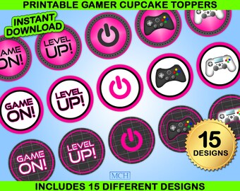 May include: Printable cupcake toppers featuring a gamer theme. The toppers include images of game controllers, power buttons, and the text "Game On!" and "Level Up!" in pink and white on a black background.